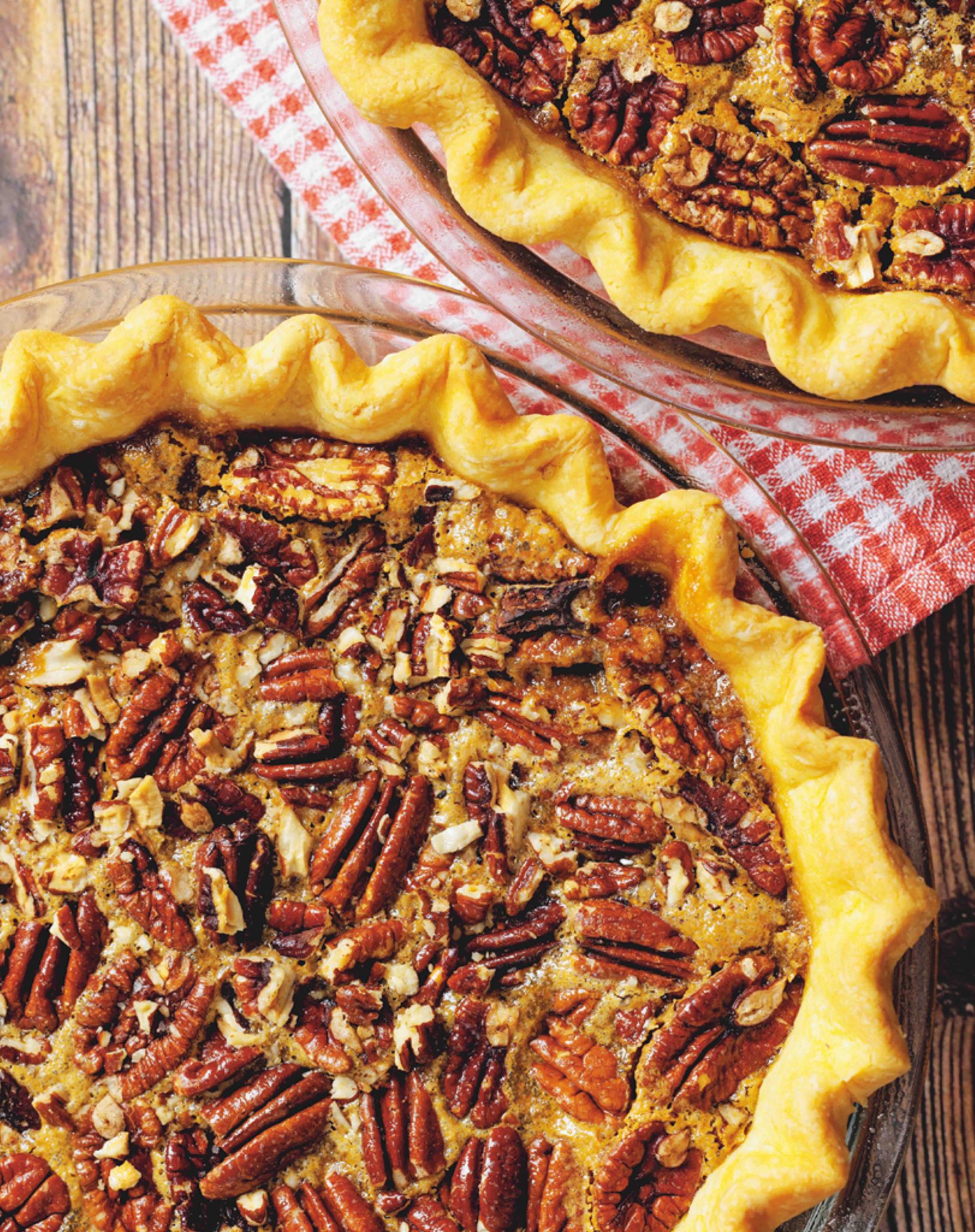 Maple pecan pie with golden pecans on a flaky crust